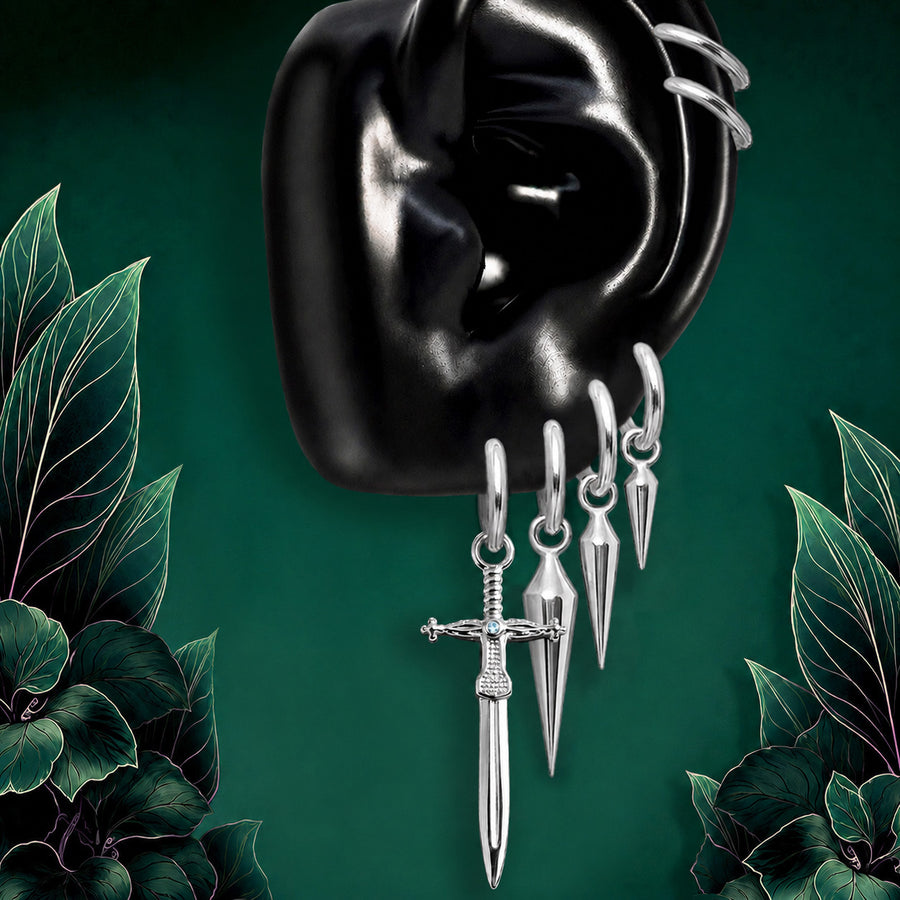 IMBER Ascendant earring stack in silver titanium with sword drop charms, on ear display