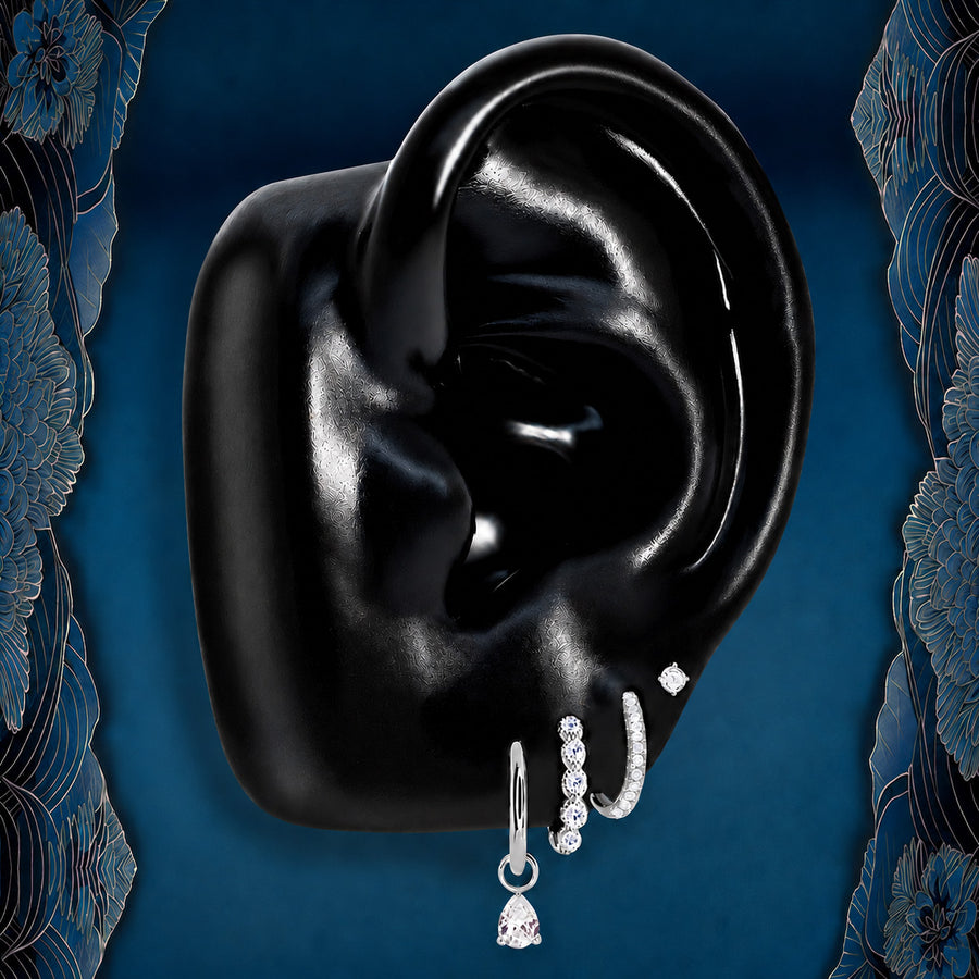 IMBER Emberlit earring stack in silver titanium with crystal huggies and drop, on ear display