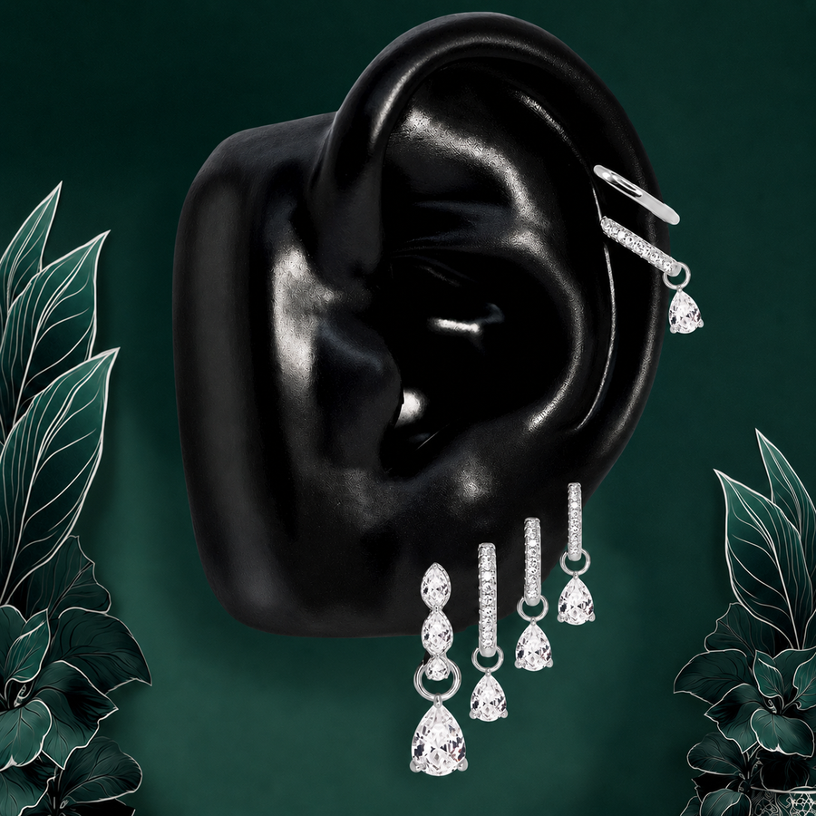 IMBER Luminary Pear earring stack in silver with pear-shaped drops, on ear display