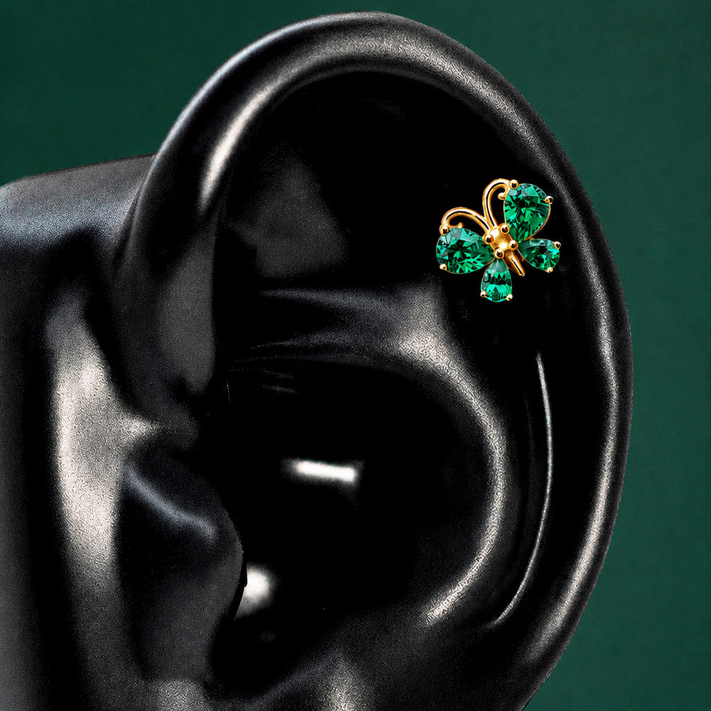 IMBER Metamorphosis Helix/Conch Green butterfly stud in gold with green stones, on ear display