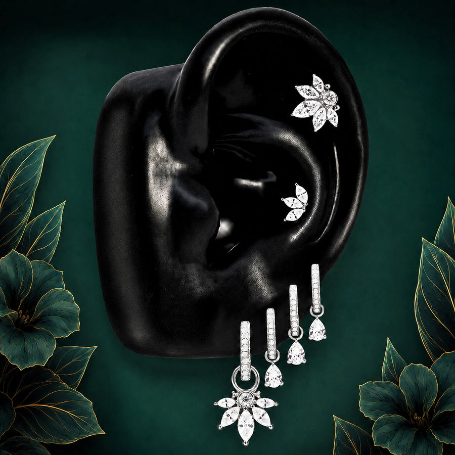 IMBER Reverence earring stack in silver with floral studs and drop huggies, on ear display