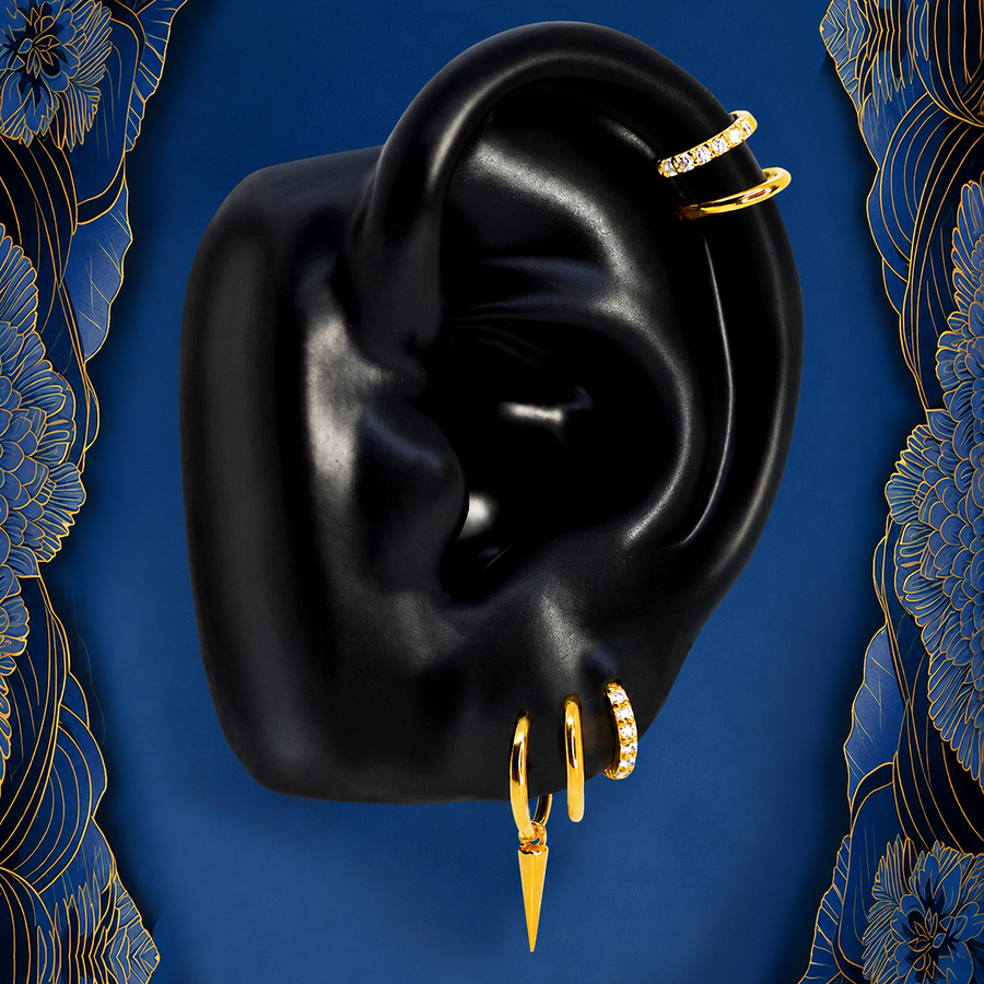 IMBER Solace earring stack in gold titanium with spike huggies, on ear display