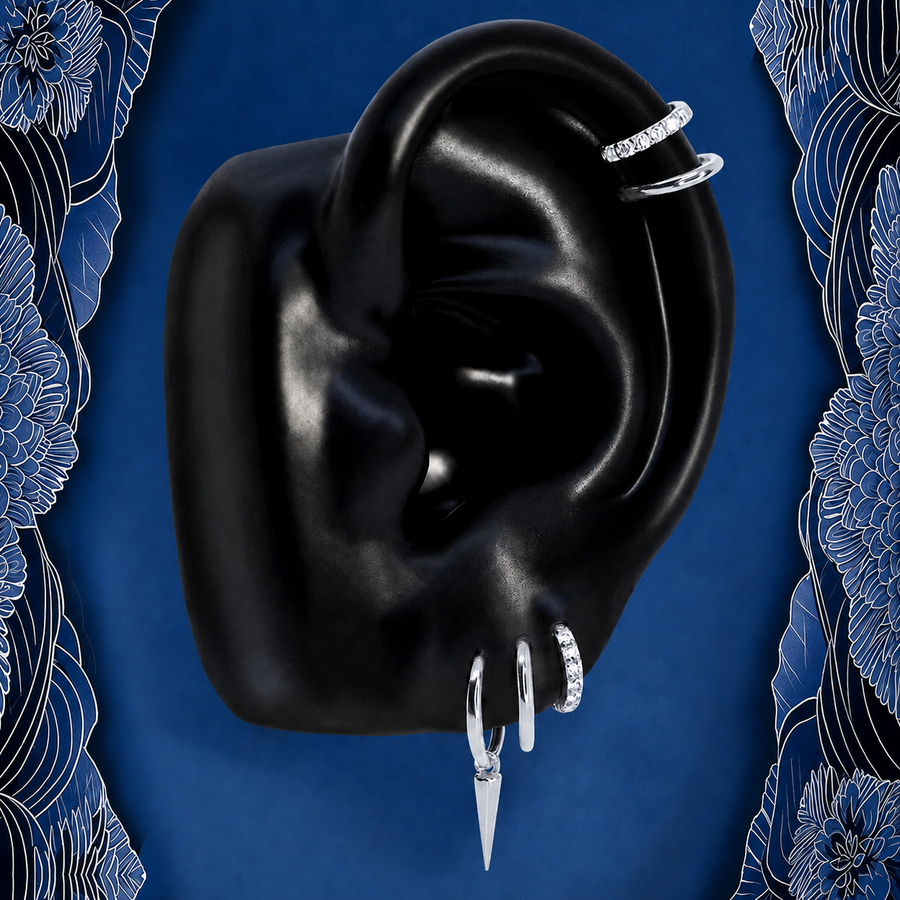 IMBER Solace earring stack in silver titanium with spike huggies, on ear display