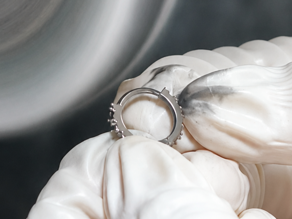 Hand polishing a titanium hoop