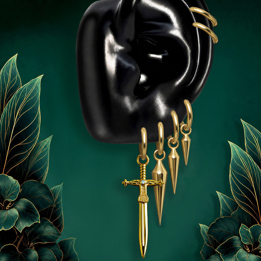 IMBER Ascendant earring stack in gold titanium with sword drop charms, on ear display