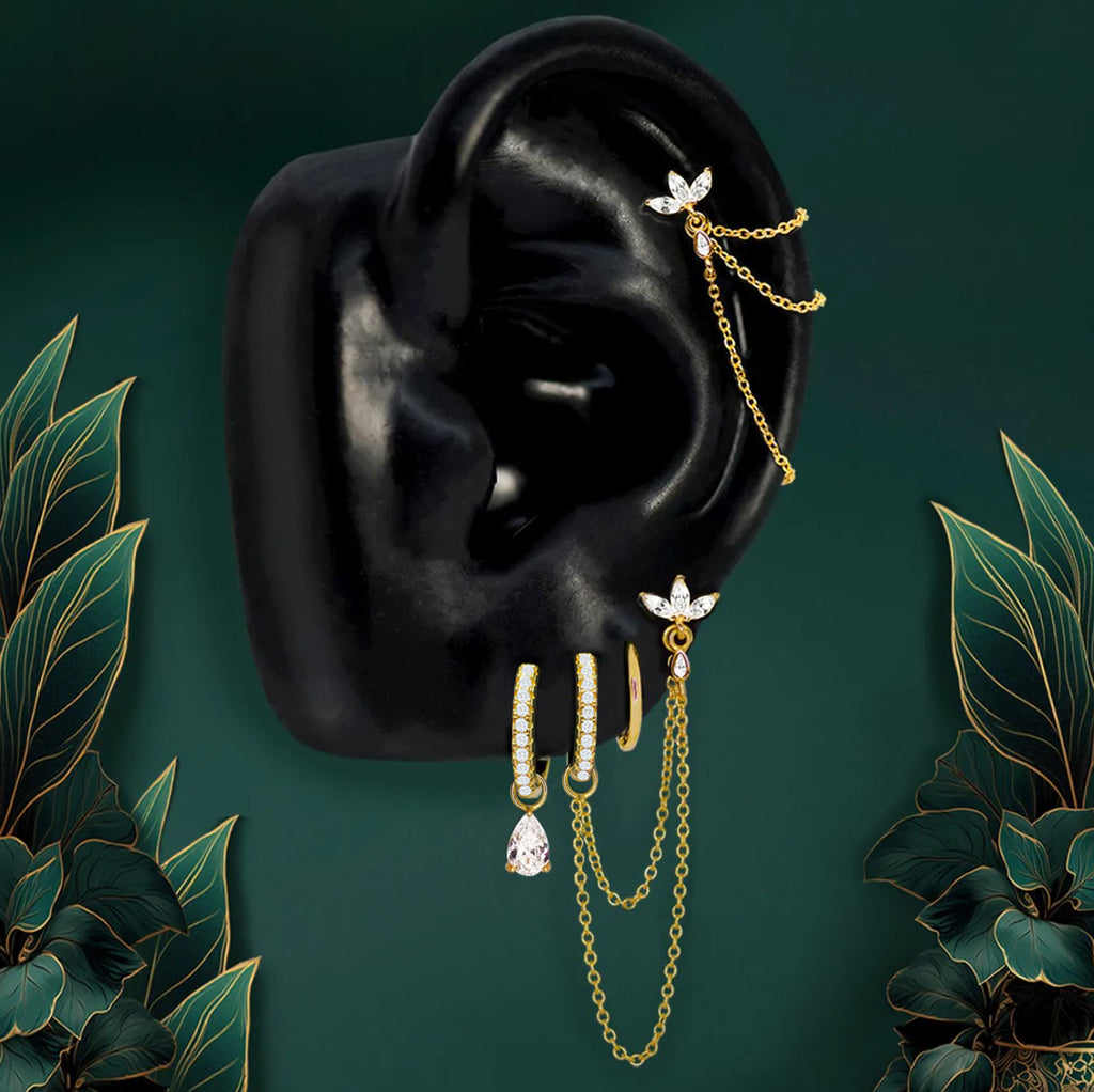 Stylish earring stack paired with classic hoop earrings for a layered look