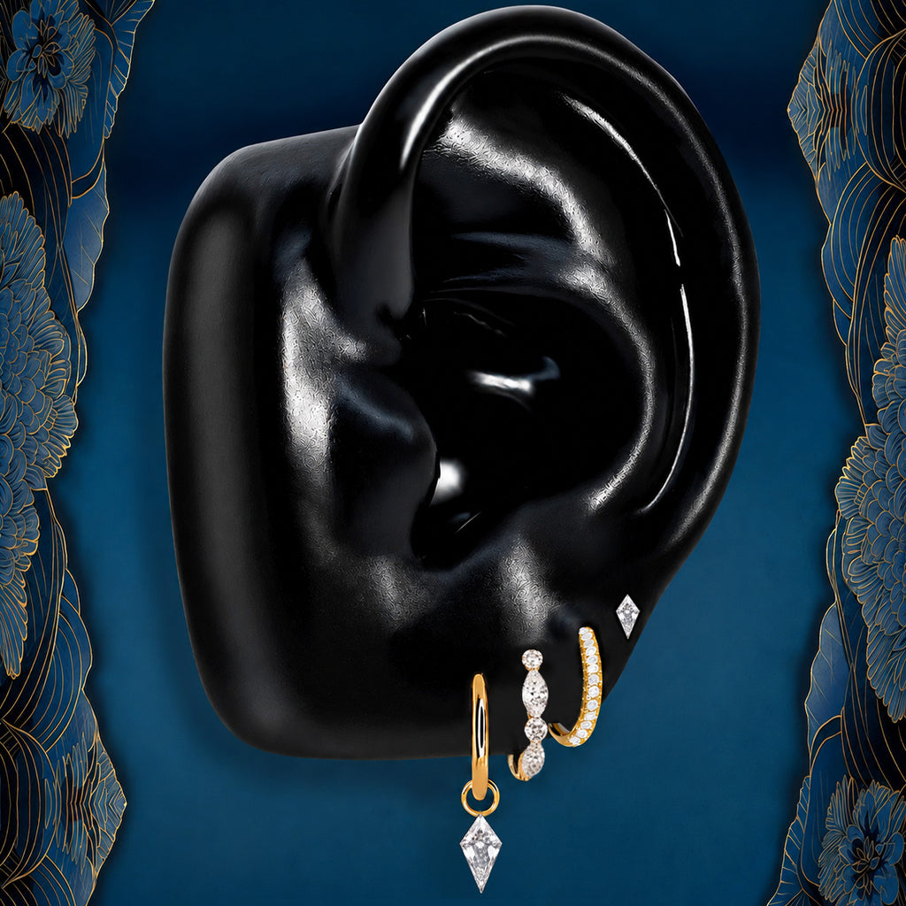 IMBER Emberlit Kite earring stack in gold with kite-cut drop and huggies, on ear display