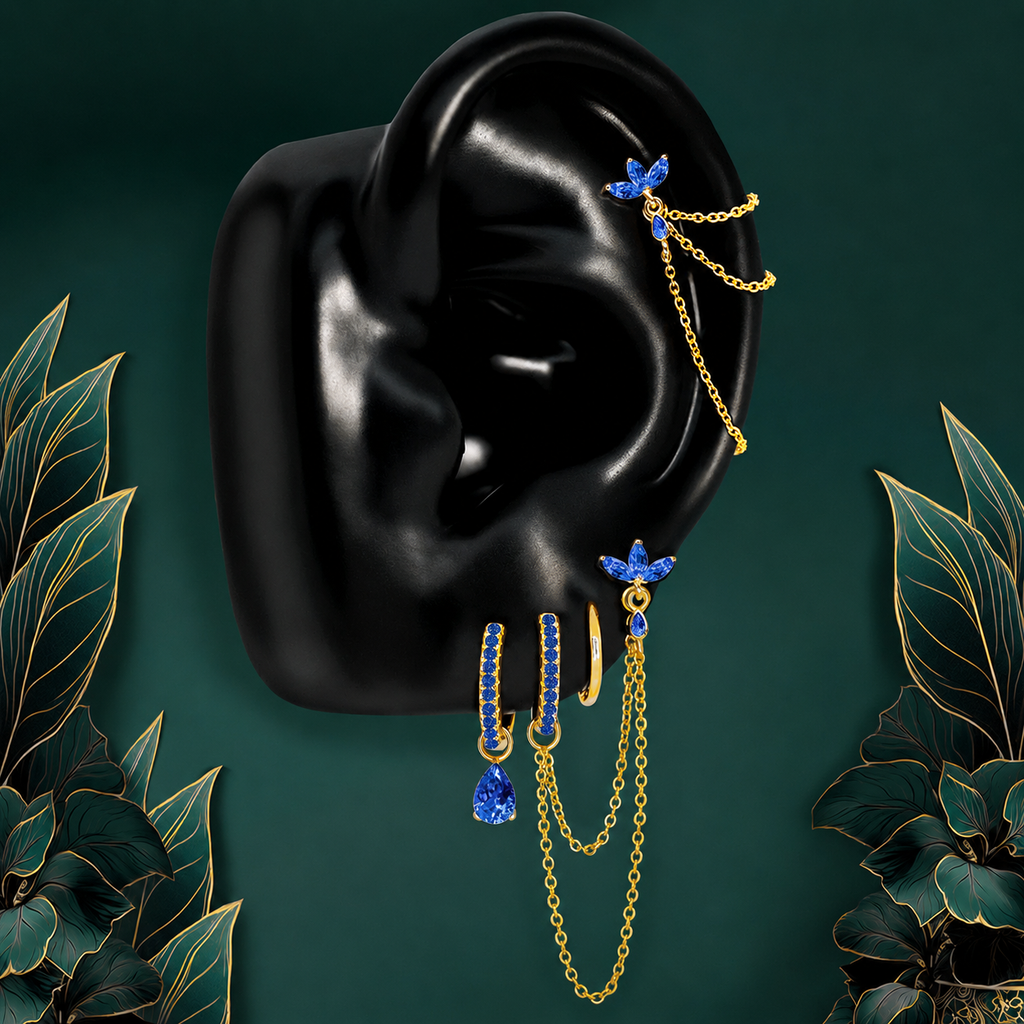 IMBER Eternal Blue earring stack in gold with blue stones and chains, on ear display
