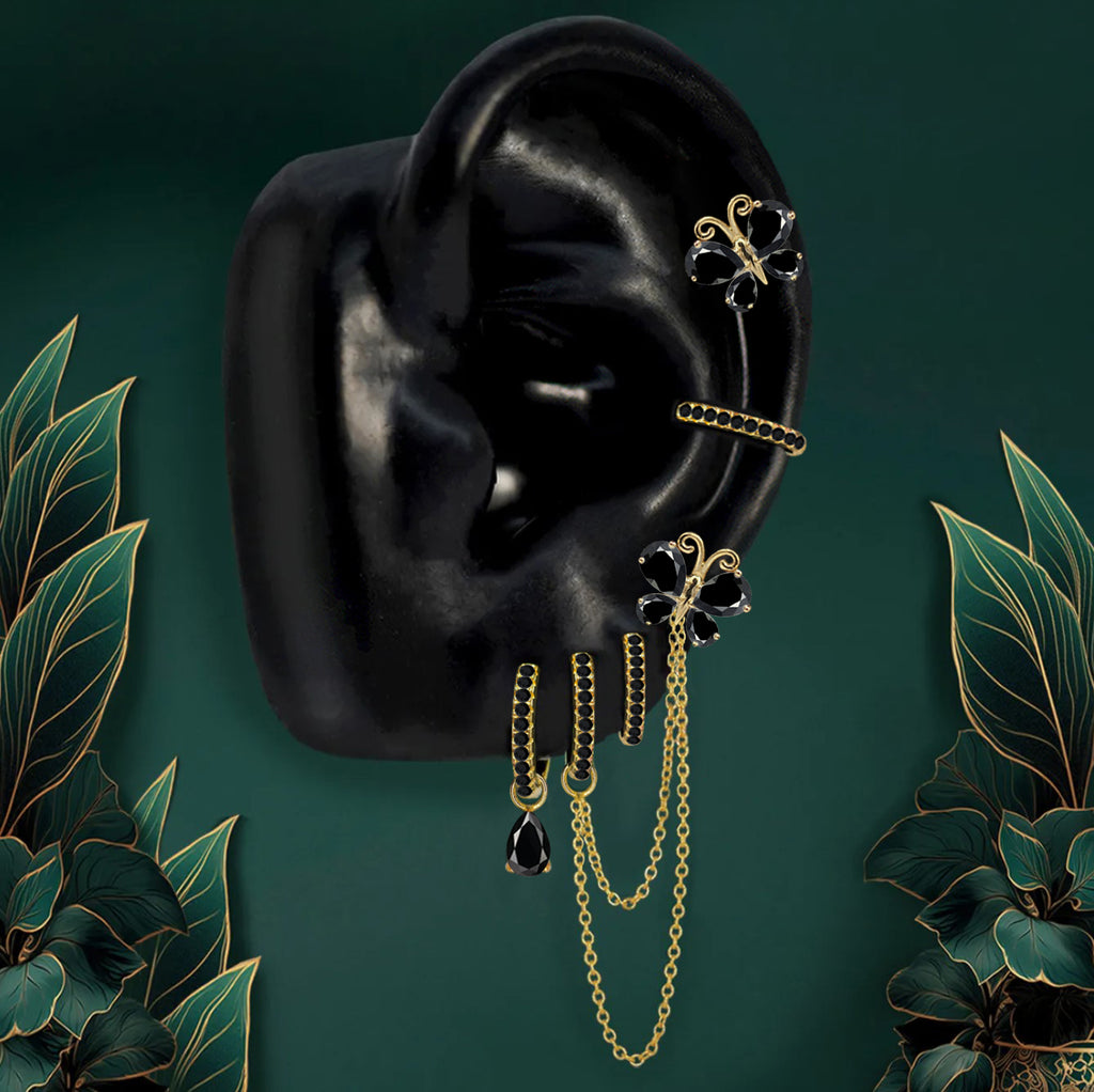 Gold butterfly hoop earrings with black gemstone wings and chains