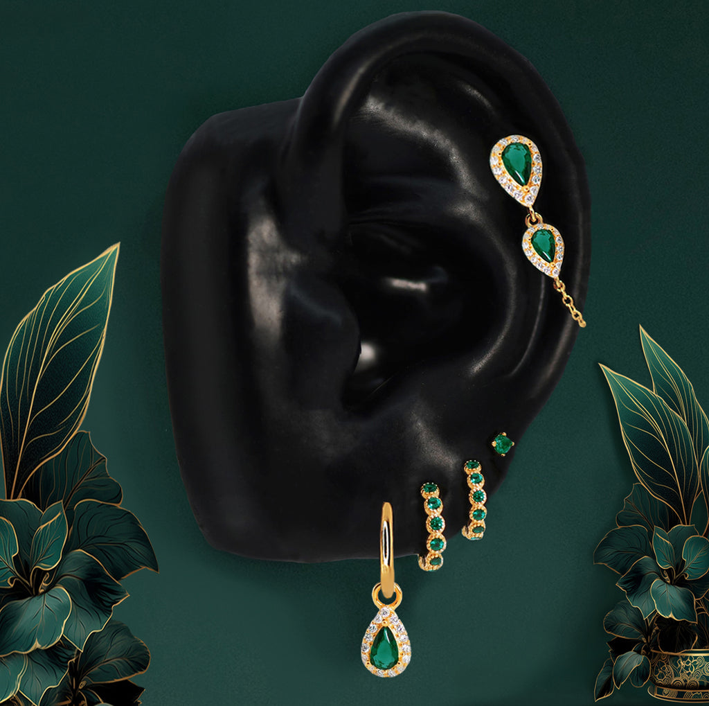 Gold emerald wedding jewelry with teardrop stones and hoops