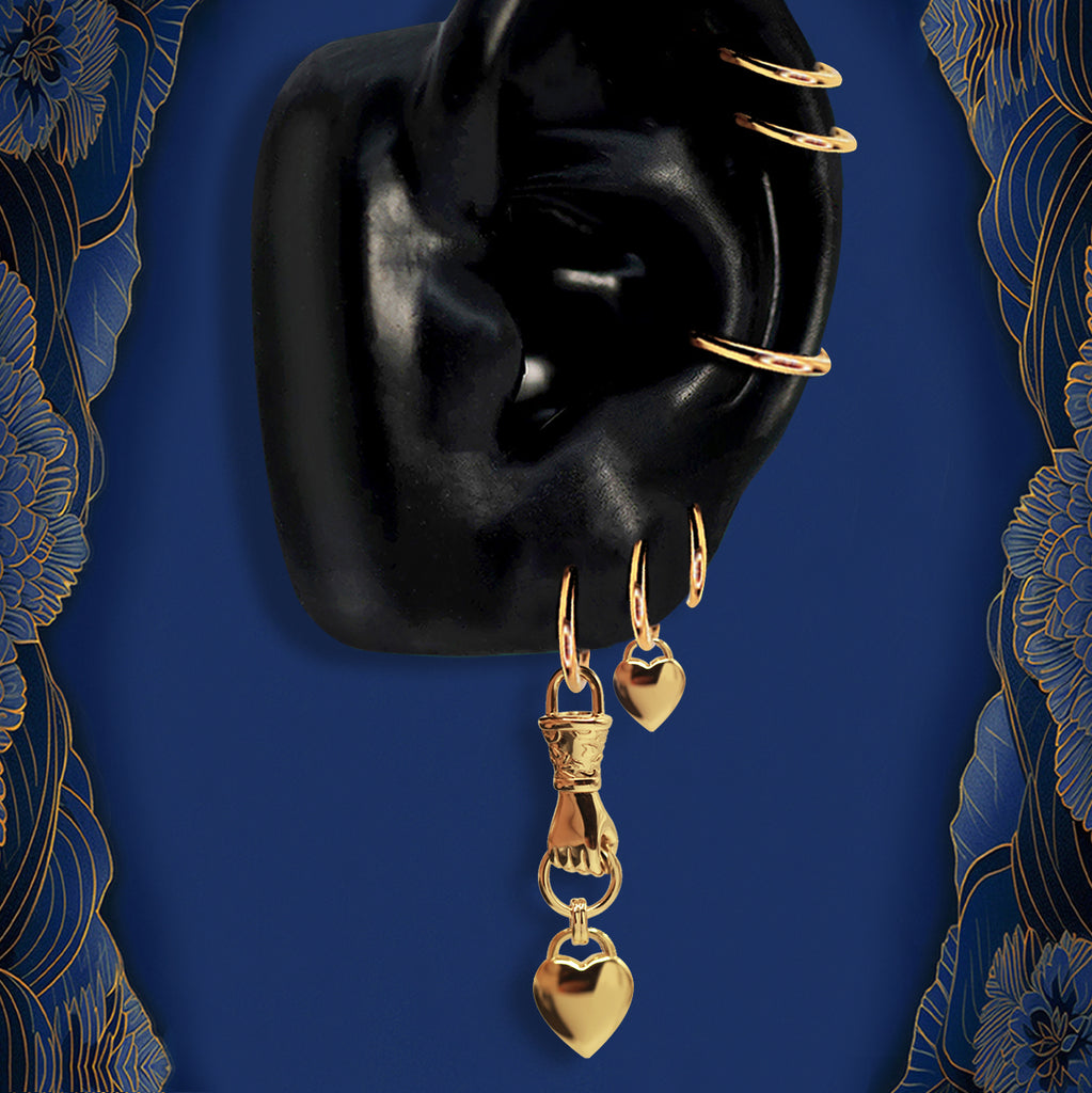 Gold heart hoop earrings with dangling charms