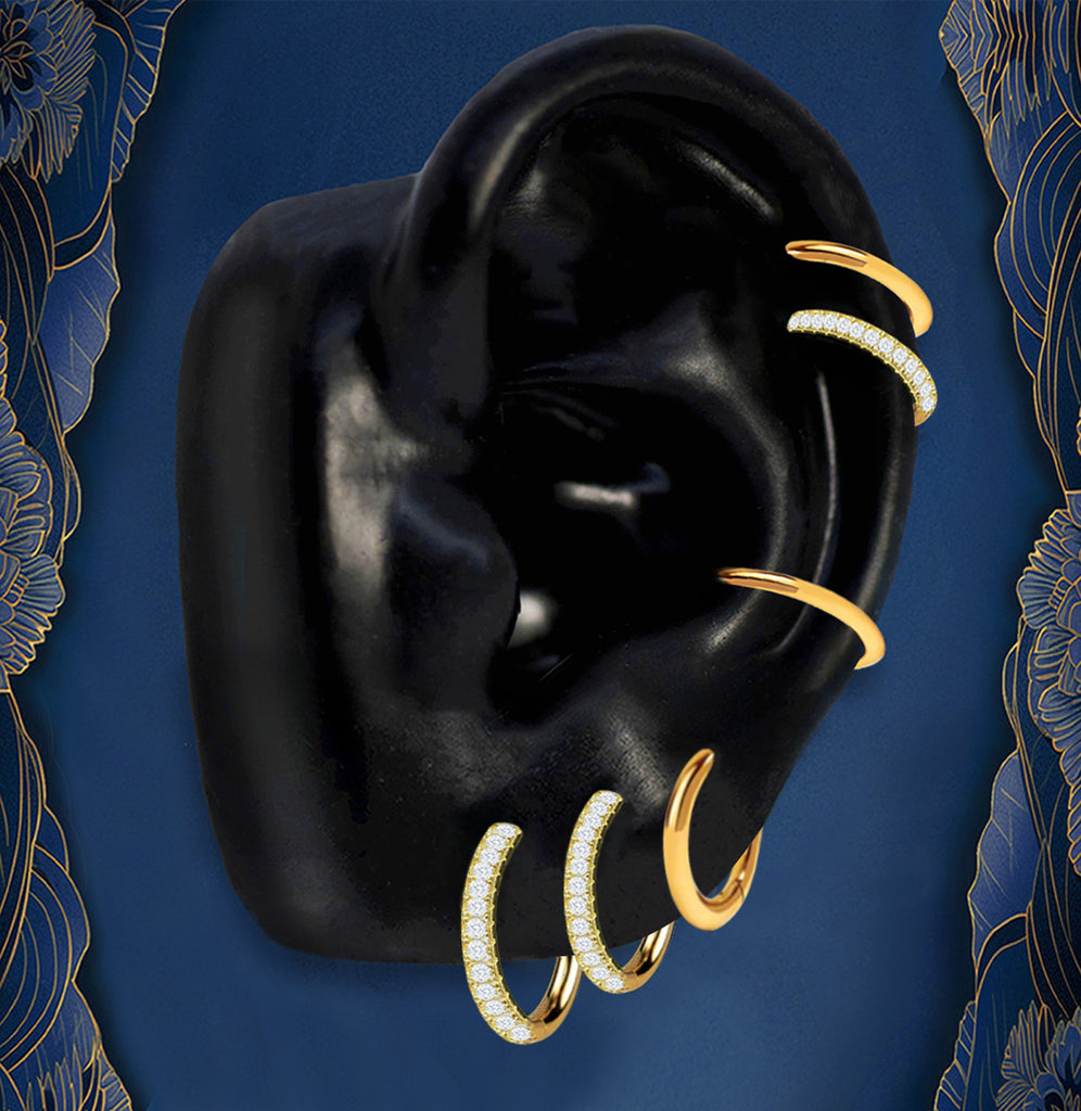 Gold hoop earrings stack with pavé huggies