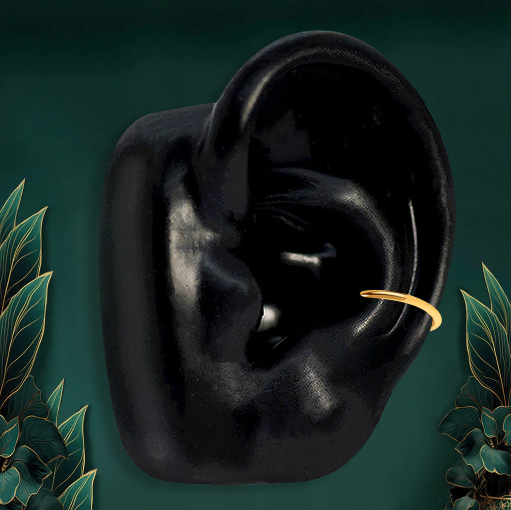 minimalist gold hoop earring designed for inner conch piercings, perfect for stacking with other ear jewelry