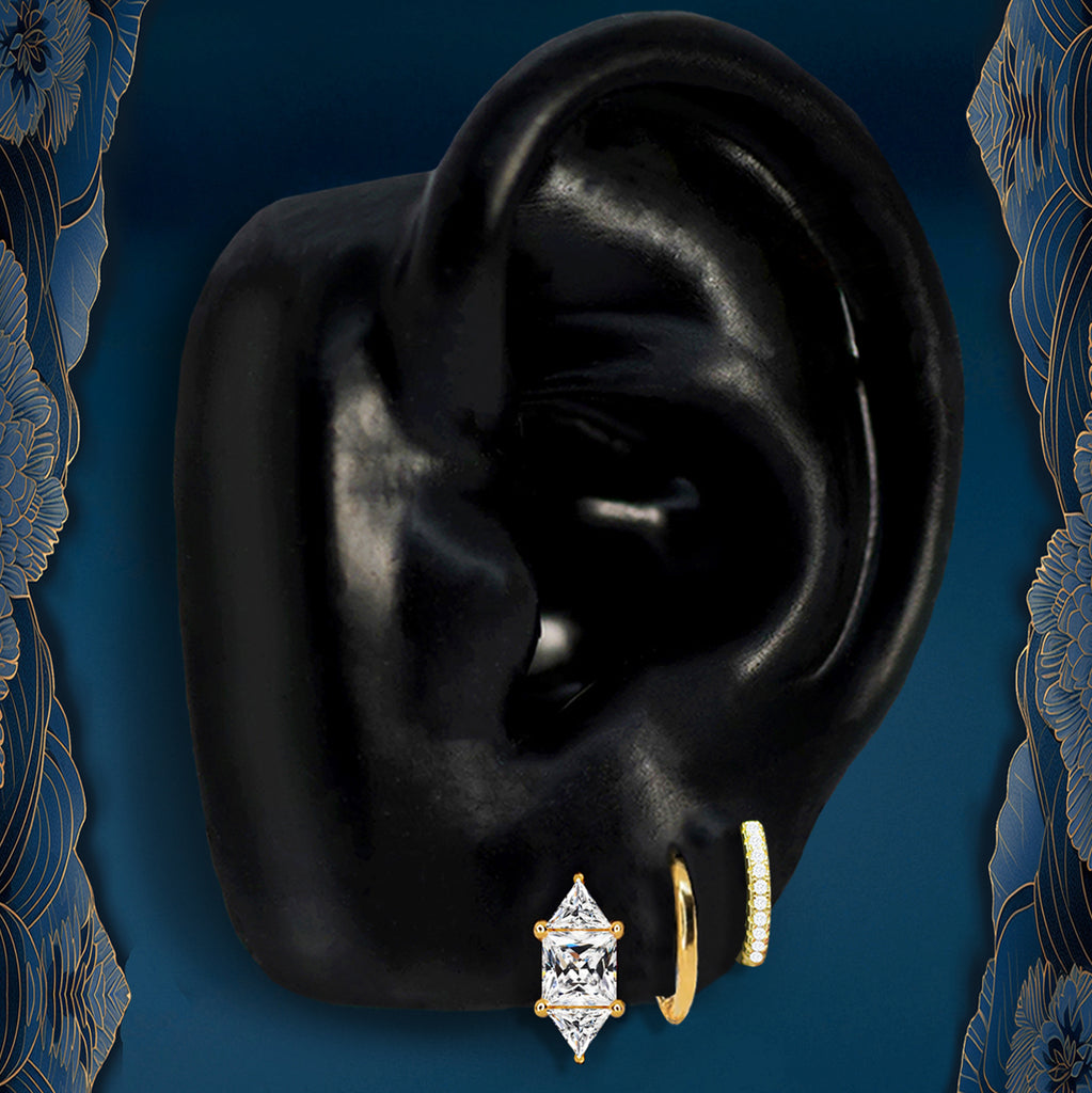 Gold huggie earrings styled as classic small hoop earrings