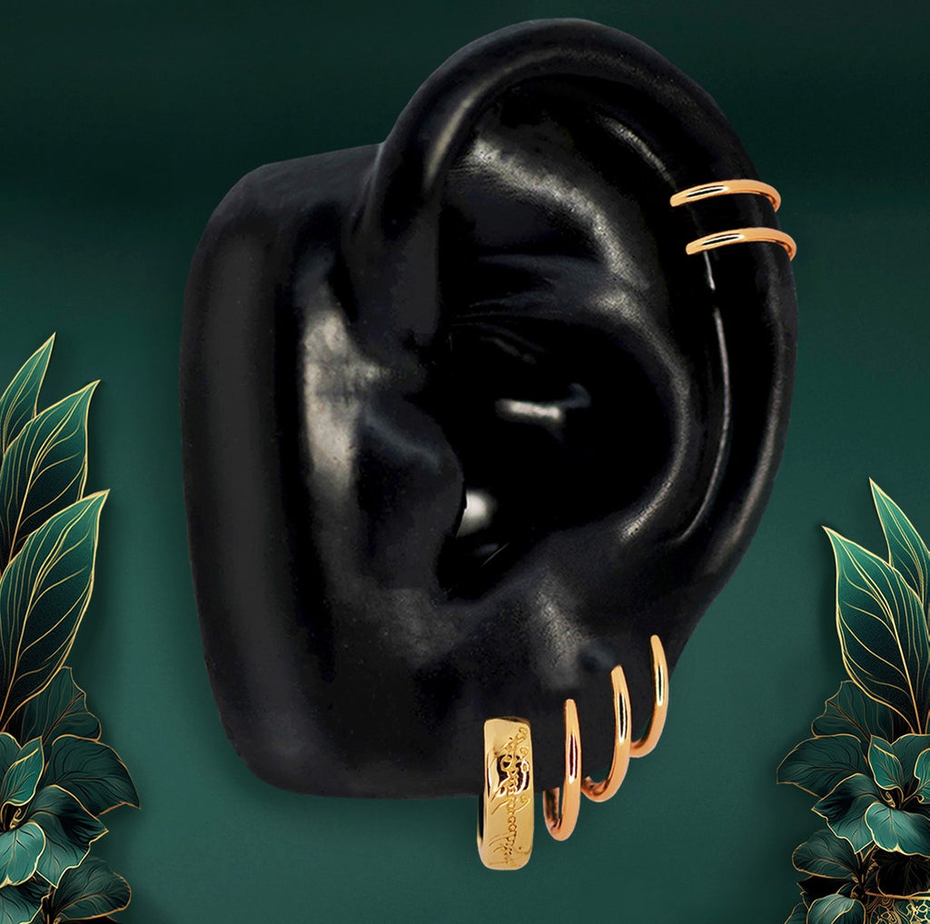 Elegant gold mini hoop earrings designed as classic huggie earrings