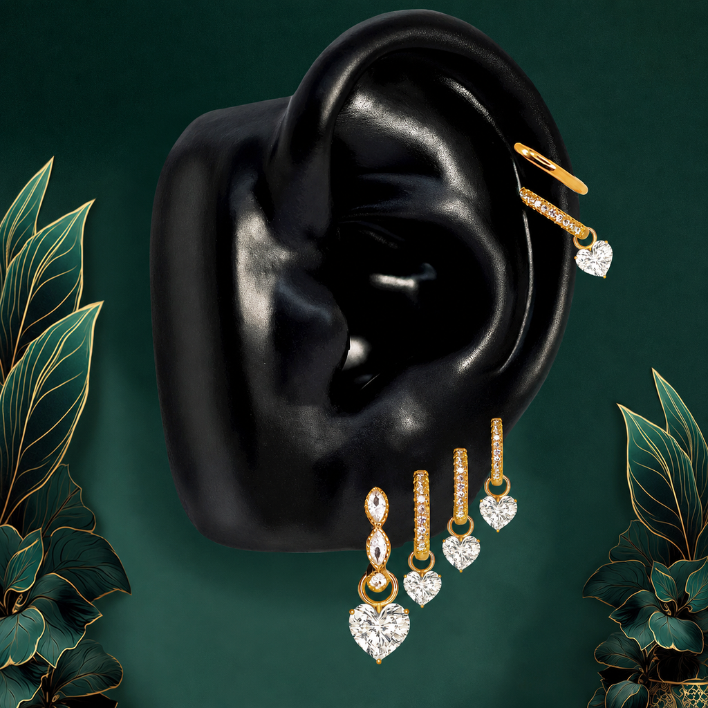 IMBER Luminary Heart earring stack in gold with heart-shaped drops, on ear display