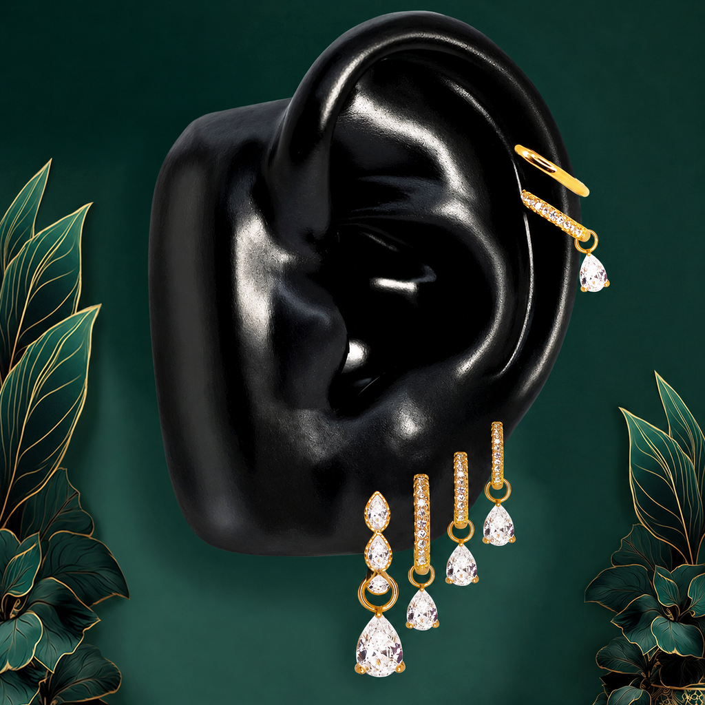 IMBER Luminary Pear earring stack in gold with pear-shaped drops, on ear display