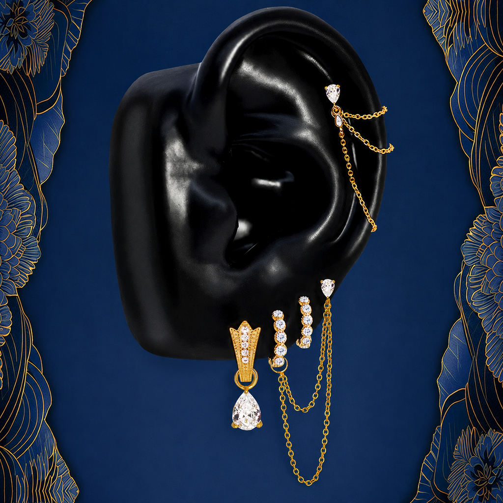 IMBER Nocturne earring stack in gold with chains and teardrop, on ear display