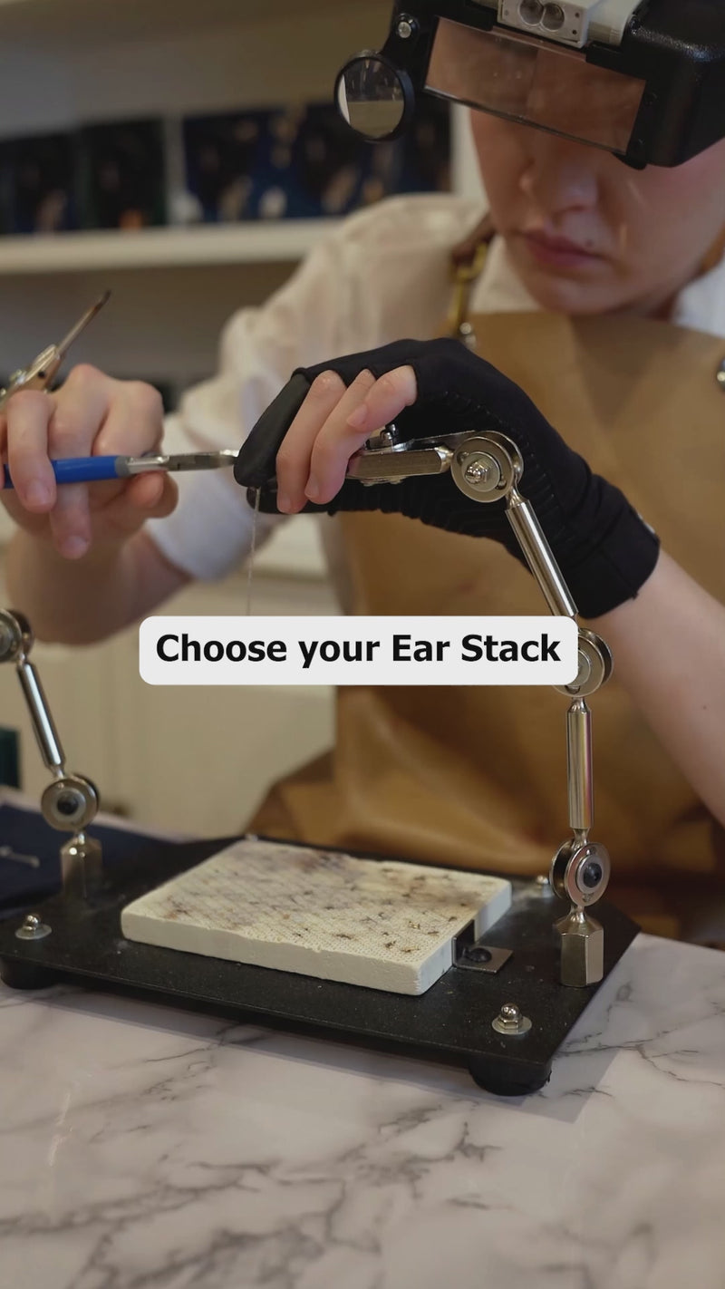 Handcrafting IMBER earring stacks in the studio, with close-up shots of gold earrings and gemstone details