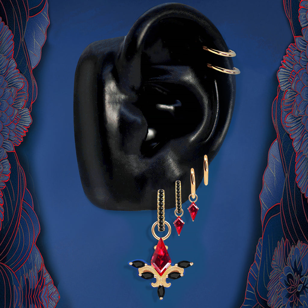 Red earrings with gold finish and black gemstone accents