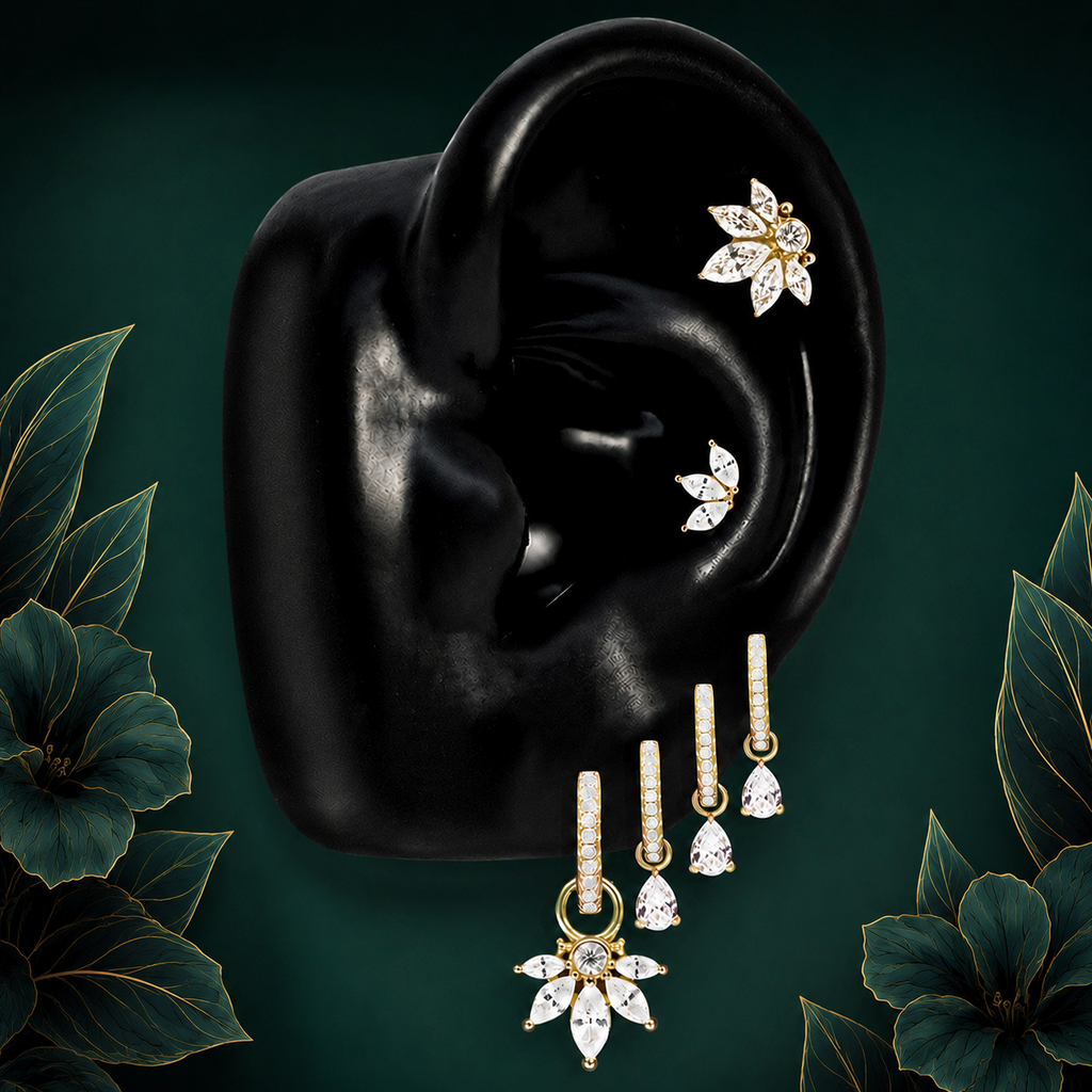 IMBER Reverence earring stack in gold with floral studs and drop huggies, on ear display