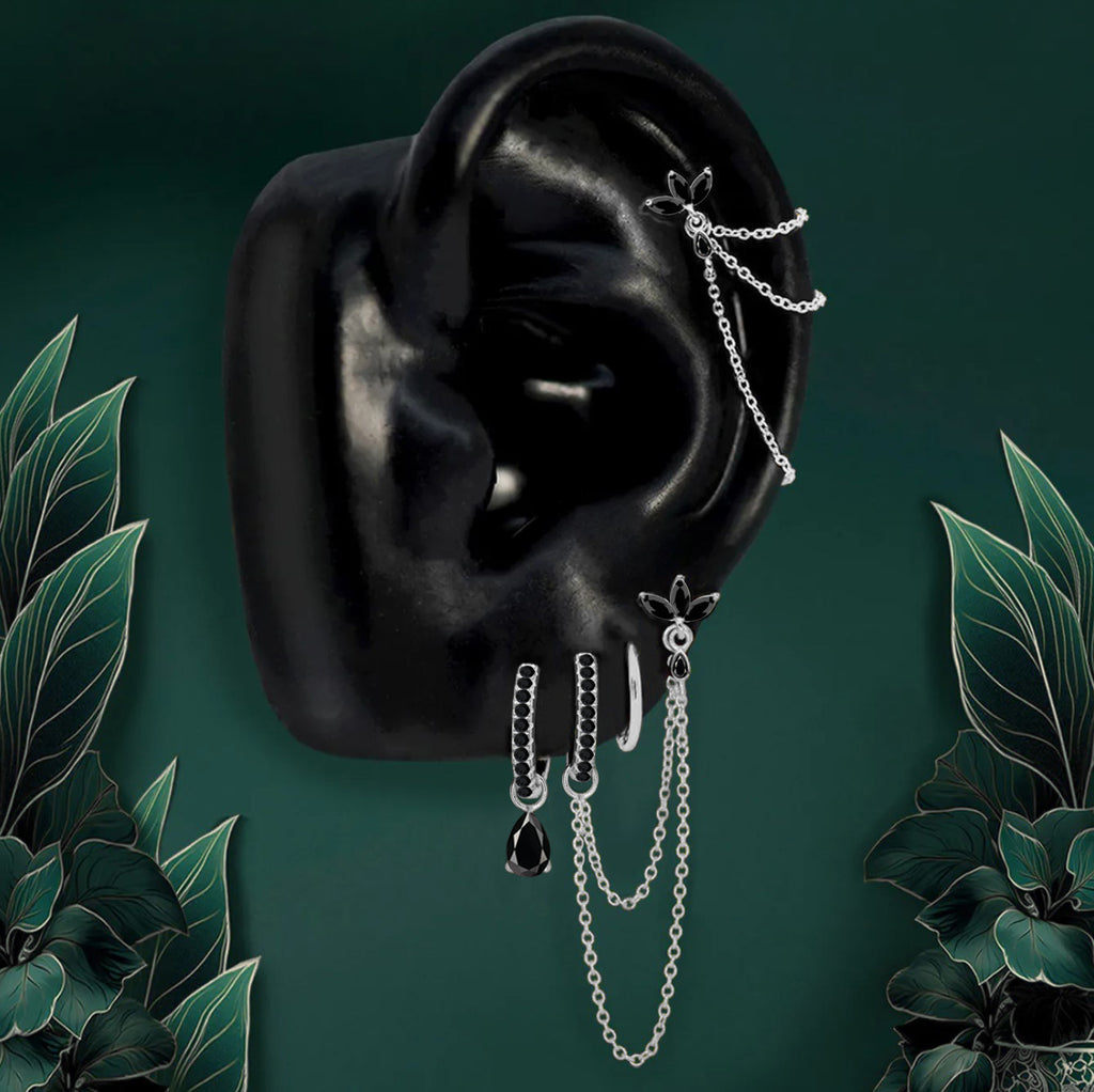 Modern silver chain drop earrings with floral accents and black onyx gems