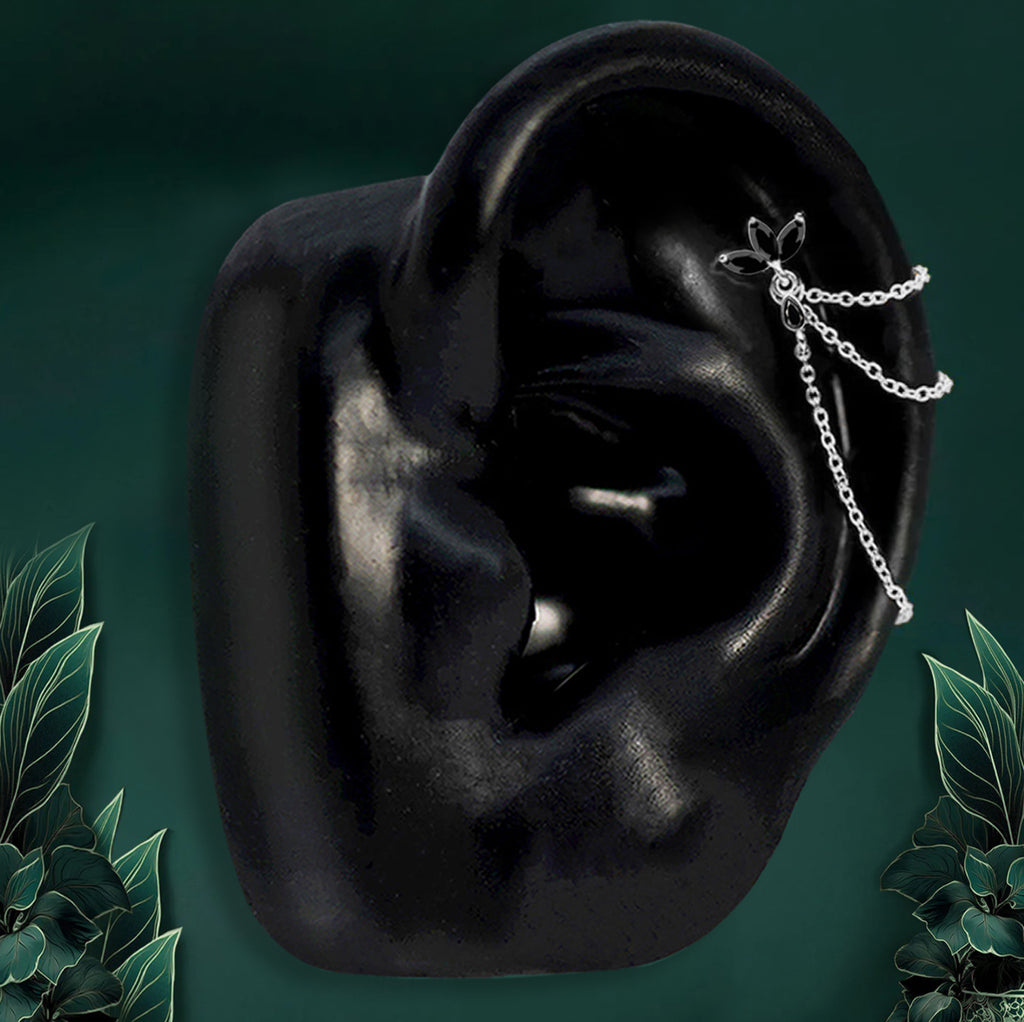 Silver onyx helix earrings styled with floral stud and chains